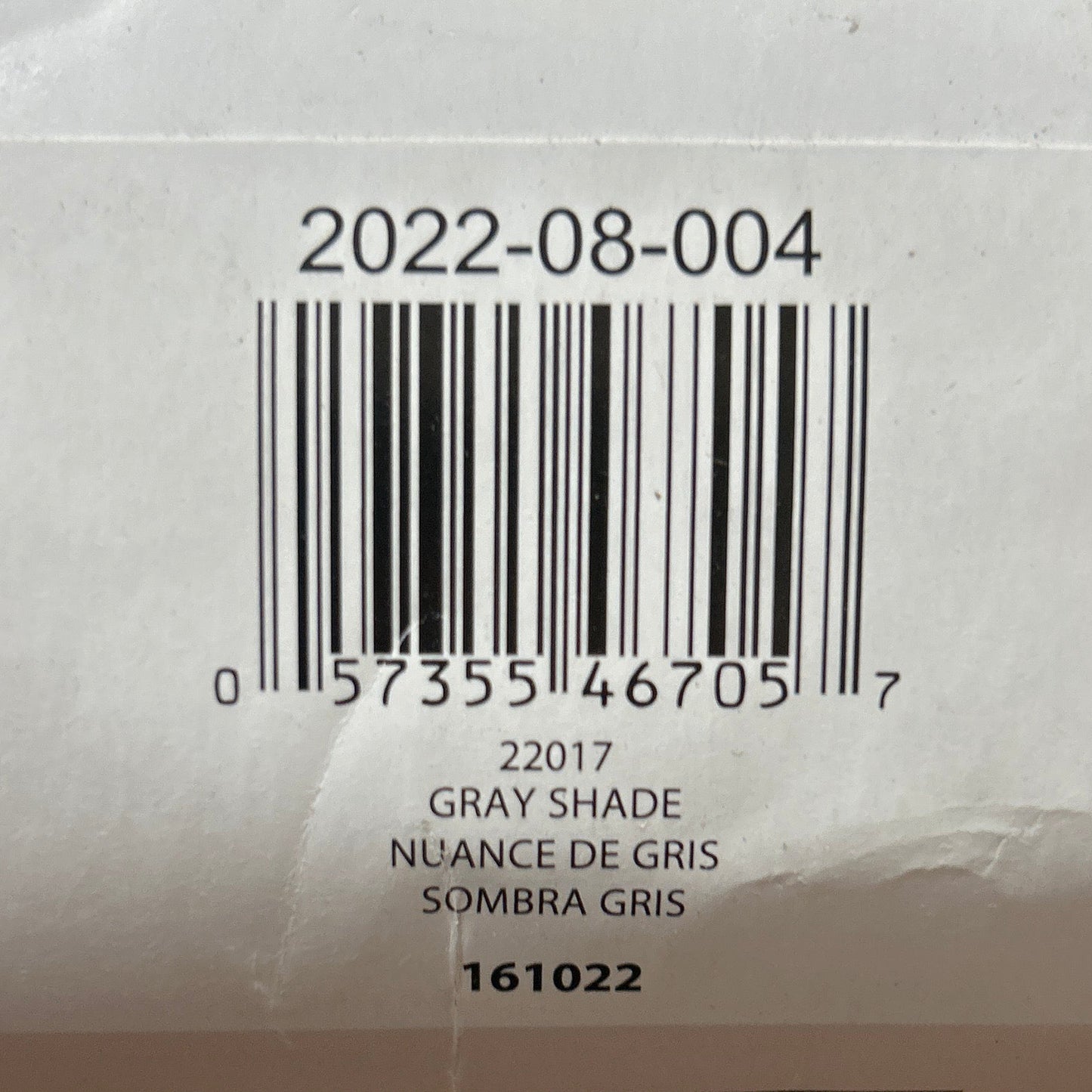 Close-up of a product label with a barcode on a textured surface