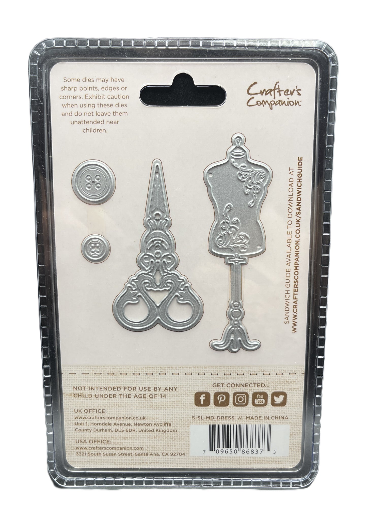 Metal die set packaging with decorative items on a white background