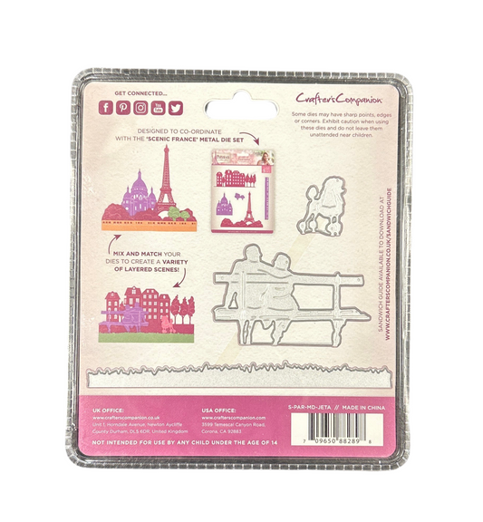 Packaged metal die set with scenic France design on a white background