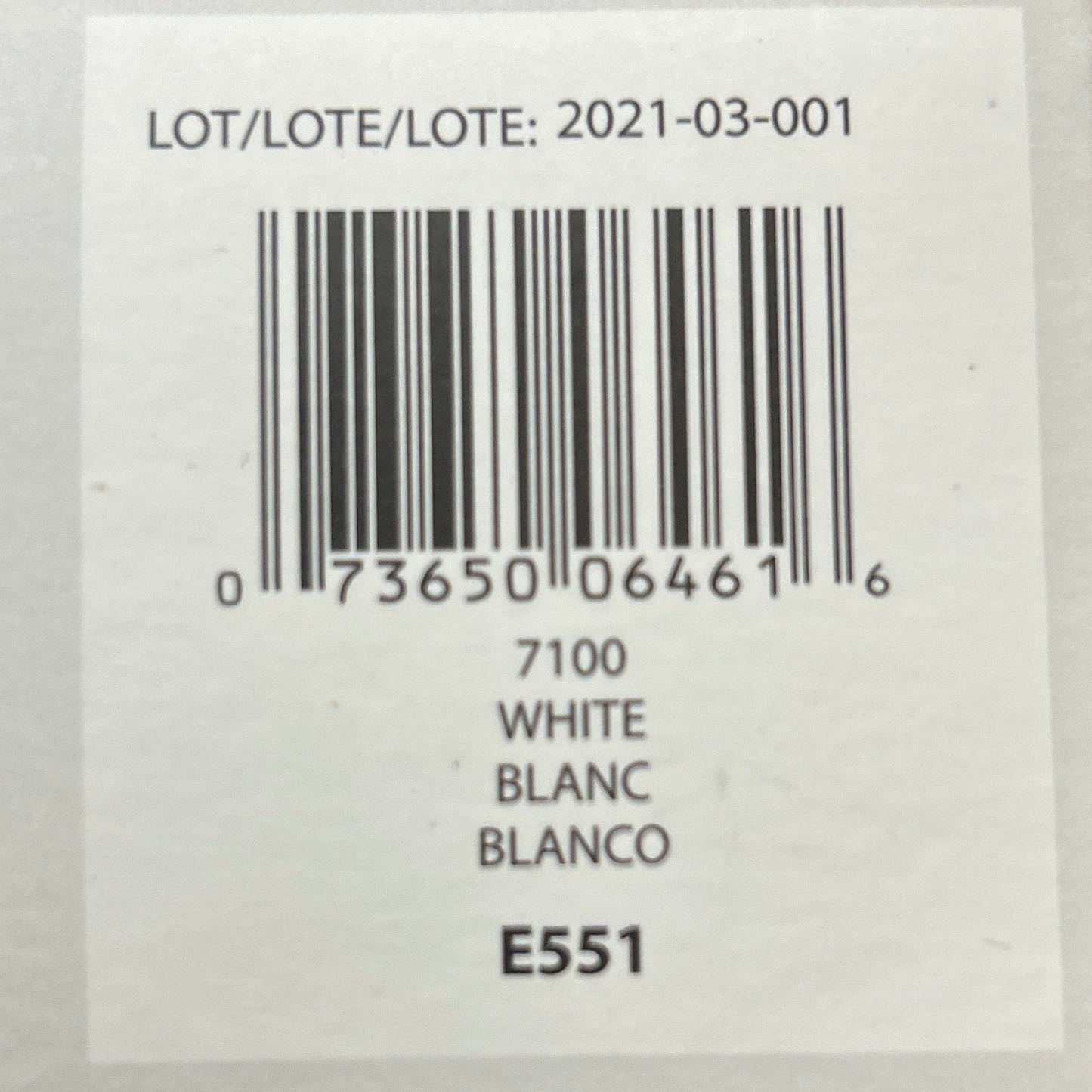 Product label with barcode and text on a wooden background