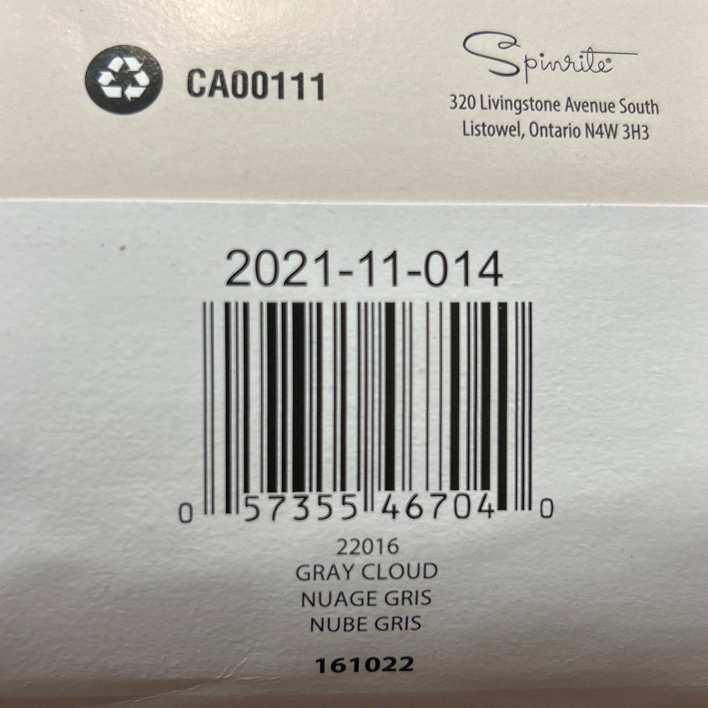 Close-up of a label on a yarn ball with text and a barcode.