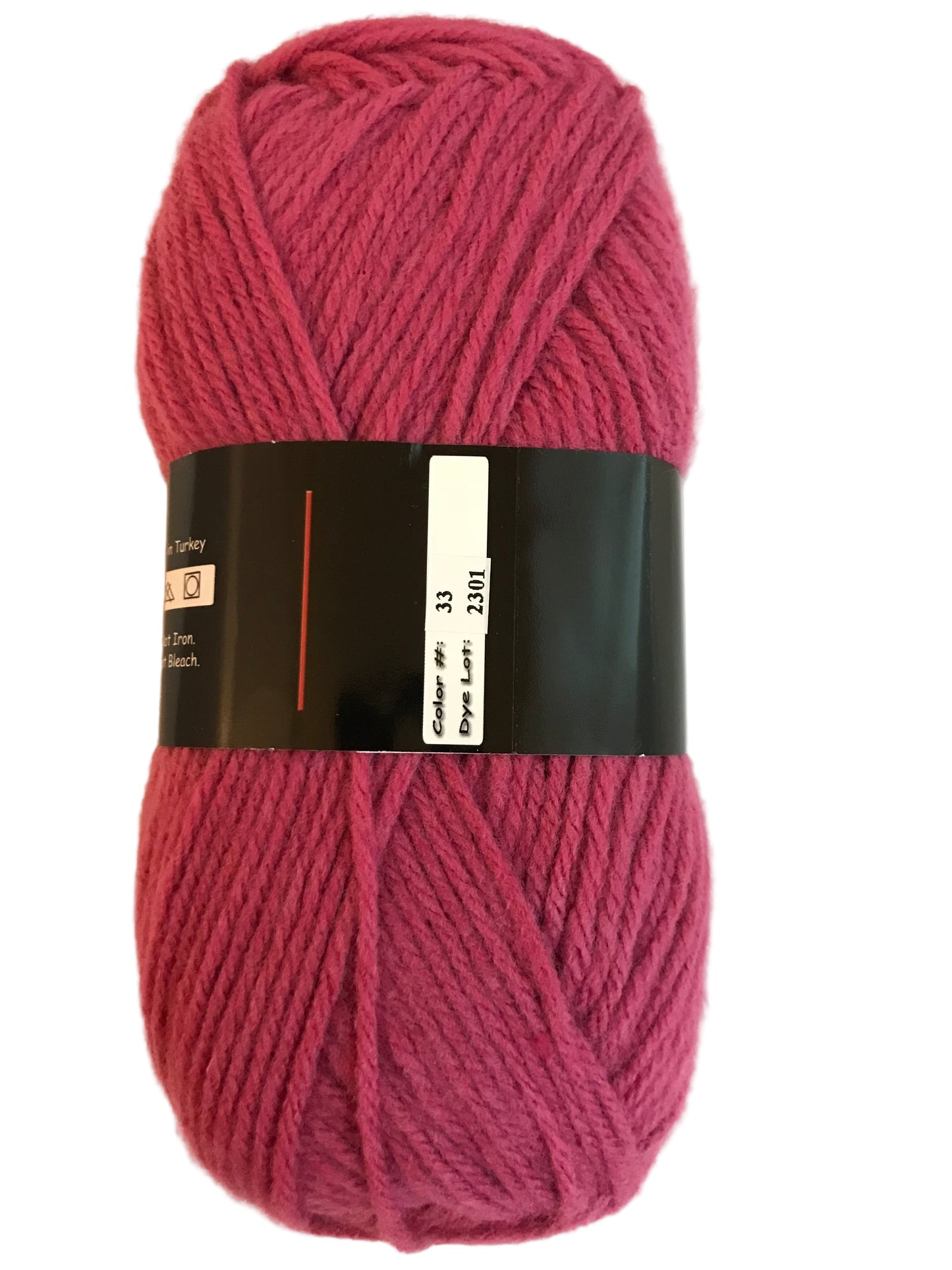 Ball of pink yarn with a label on a light background
