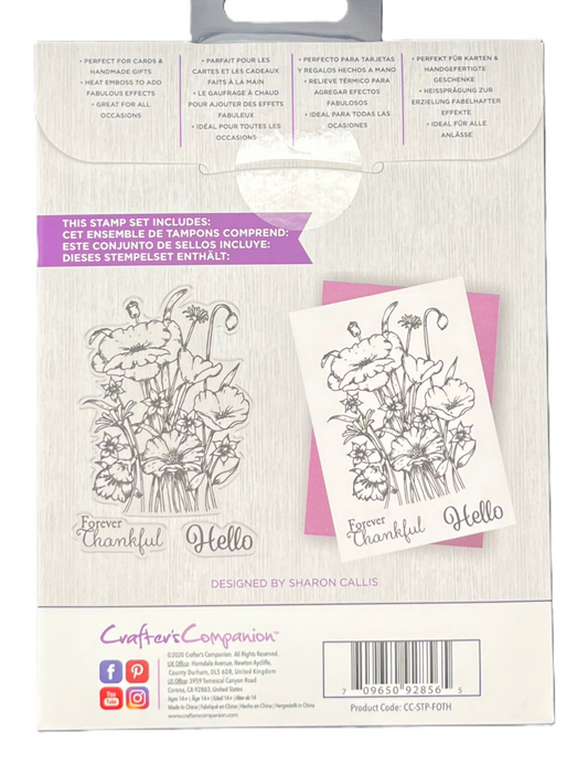 Floral stamp set packaging with stamps and die-cut card on a white background