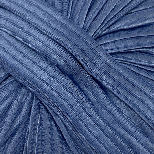 Close-up of pleated blue fabric texture