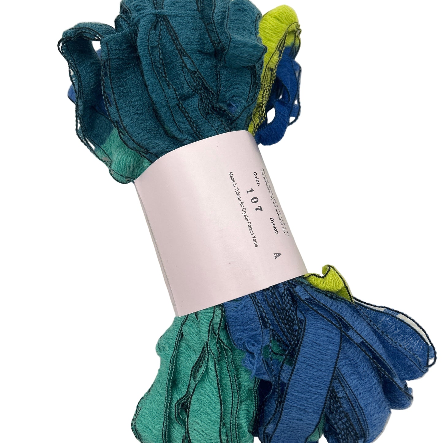Color swatch card with teal, blue, and green fabric samples on a white background