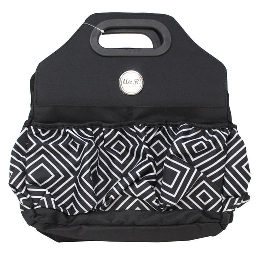 Black and white patterned bag with a visible brand logo on a white background