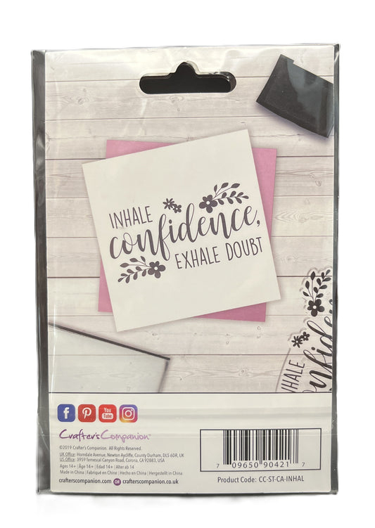 Packaged product with motivational card on a wooden surface