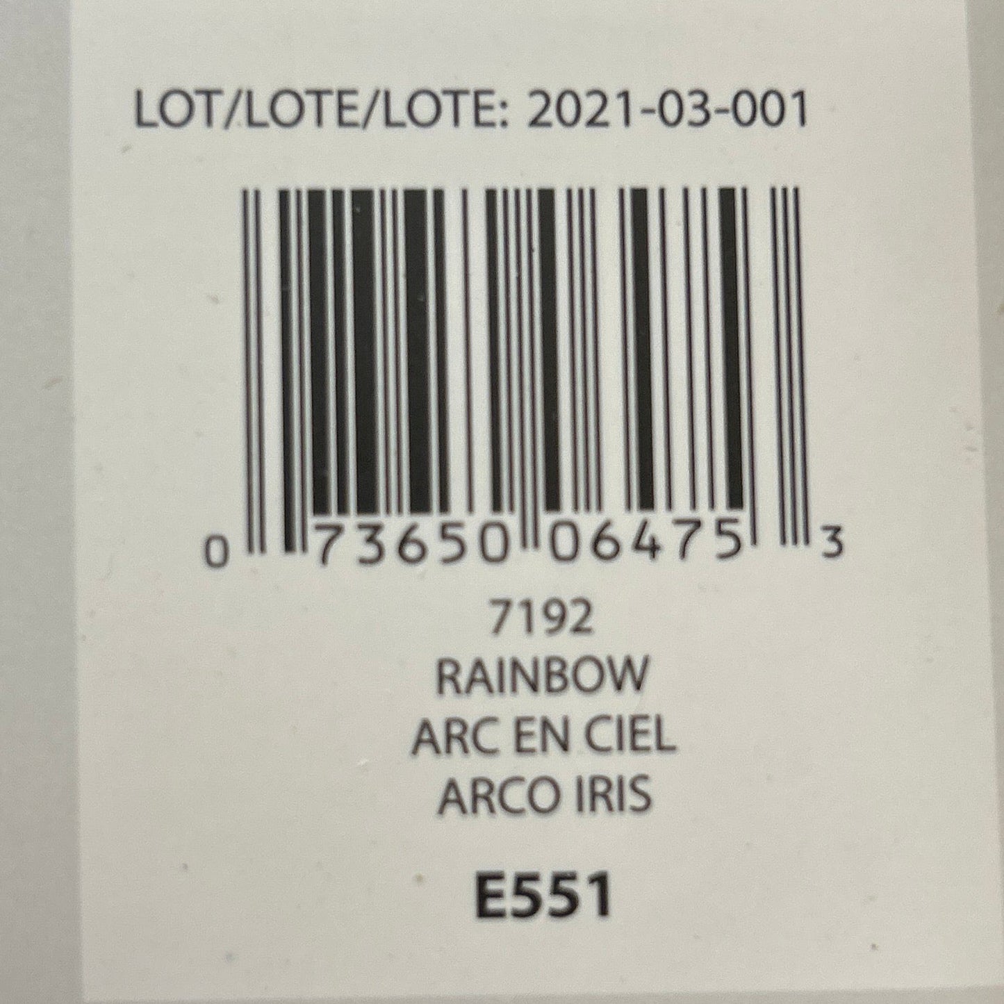 Product label with barcode and text on a wooden surface