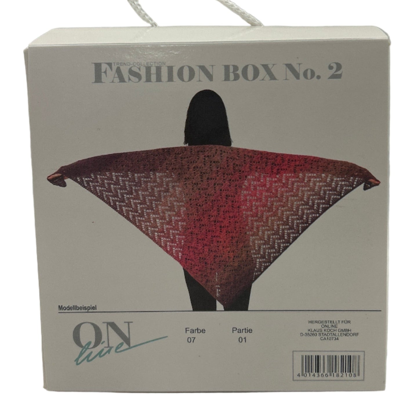 Fashion box with a patterned scarf on a white background
