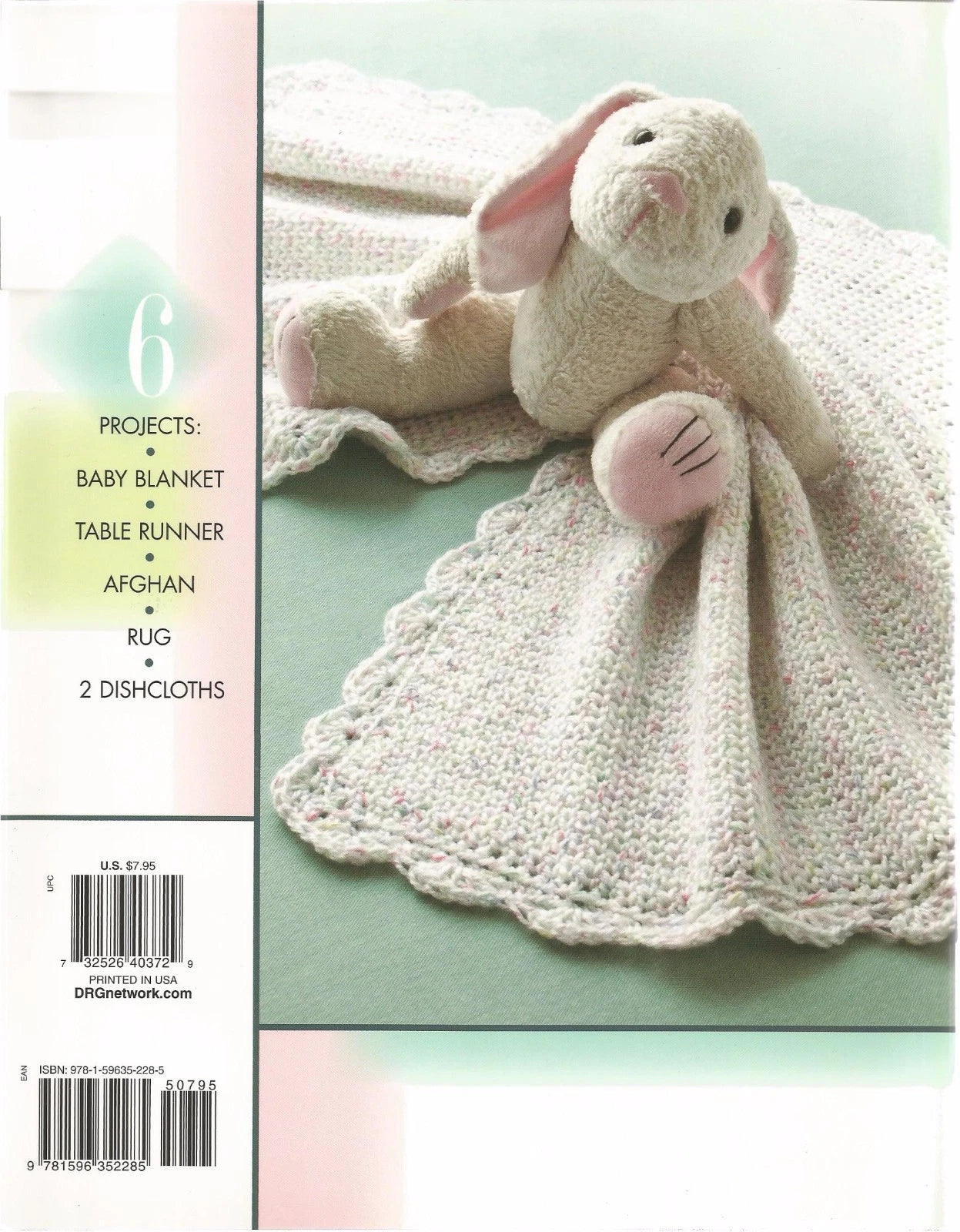 Crocheted bunny toy with blanket on a light green background