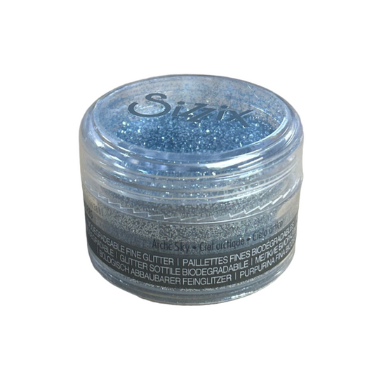 Container of Sizzix glitter on a white background