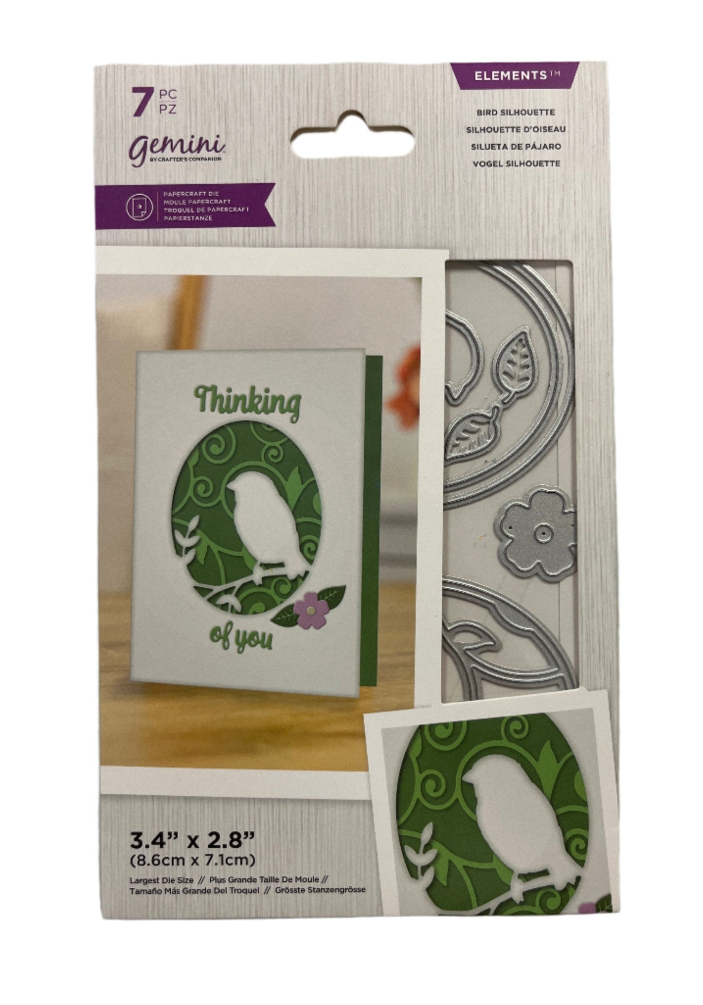 Packaging of Gemini metal dies with a card and die on a white background