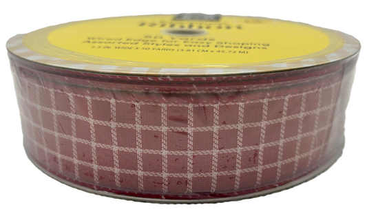 Roll of red and white checkered ribbon with a yellow label