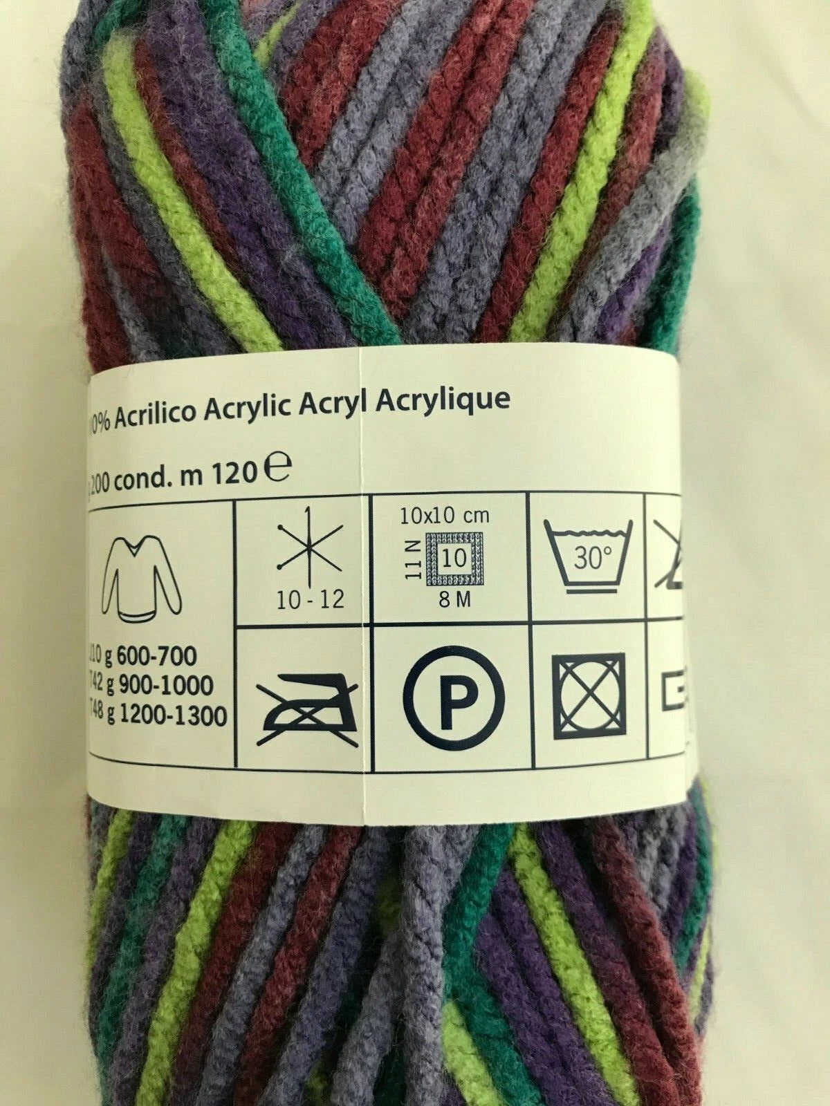 Multicolored yarn skein with label on a white background