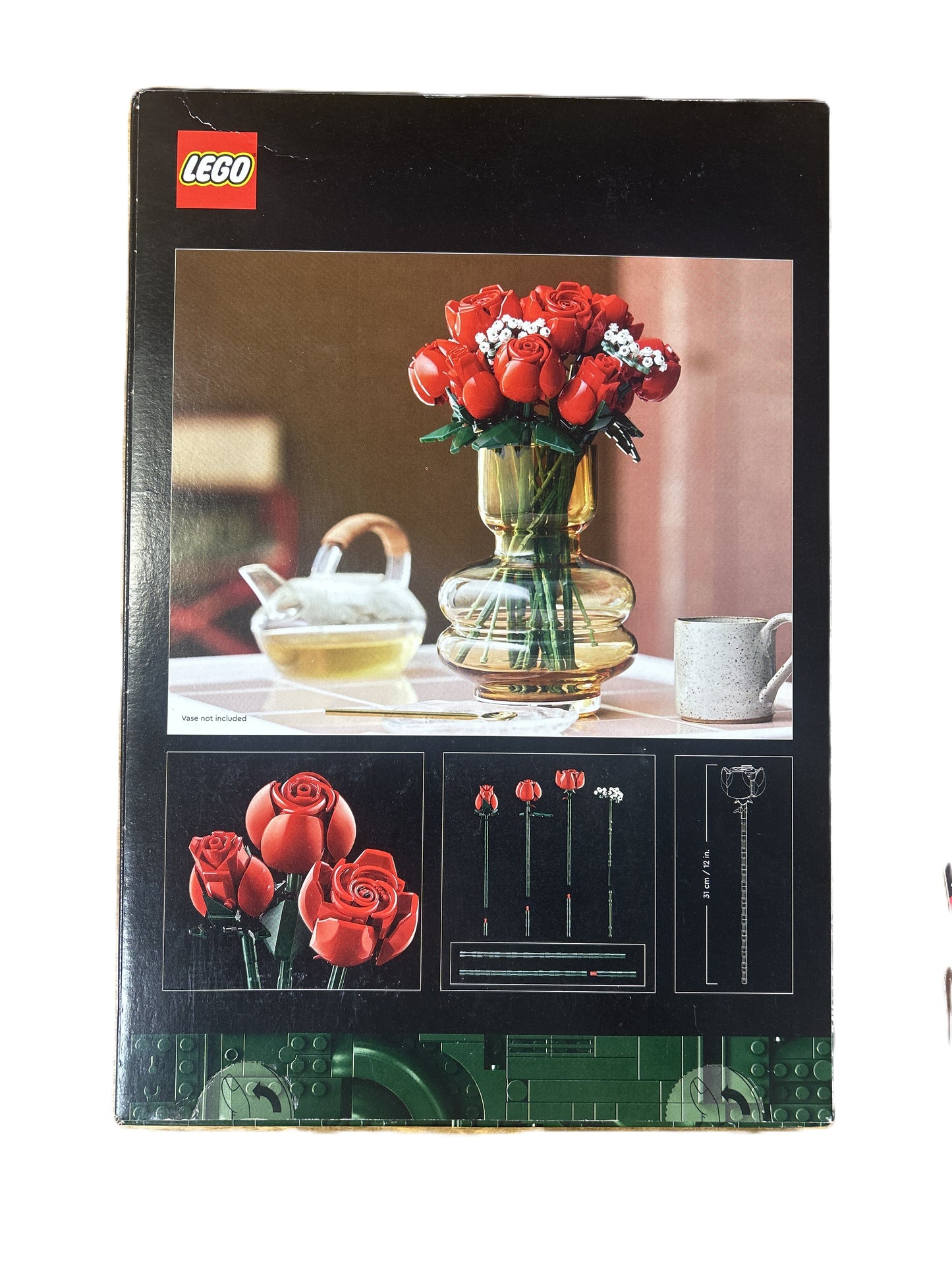 LEGO set packaging with red roses and a vase on a table