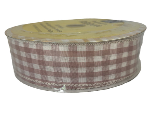 Spool of brown and white checkered ribbon on a white background