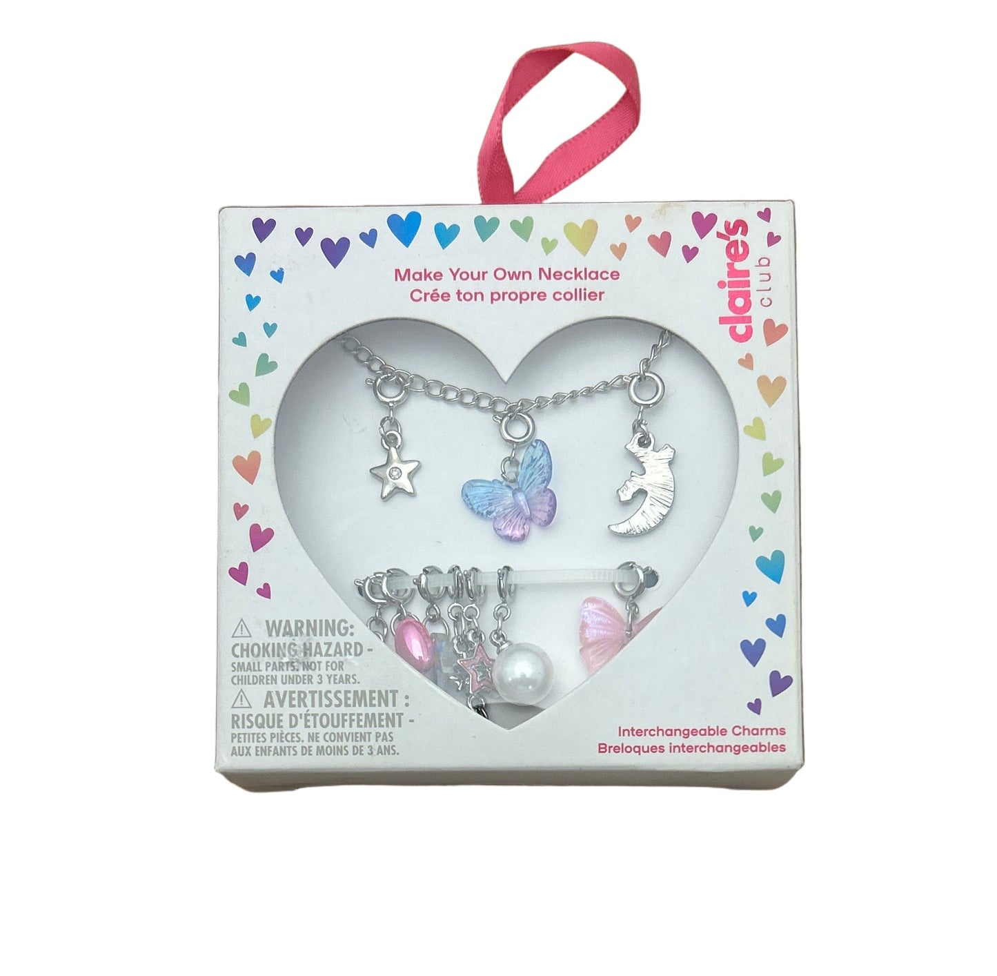 Delaire's Club necklace kit with charms in a heart-shaped box on a white background