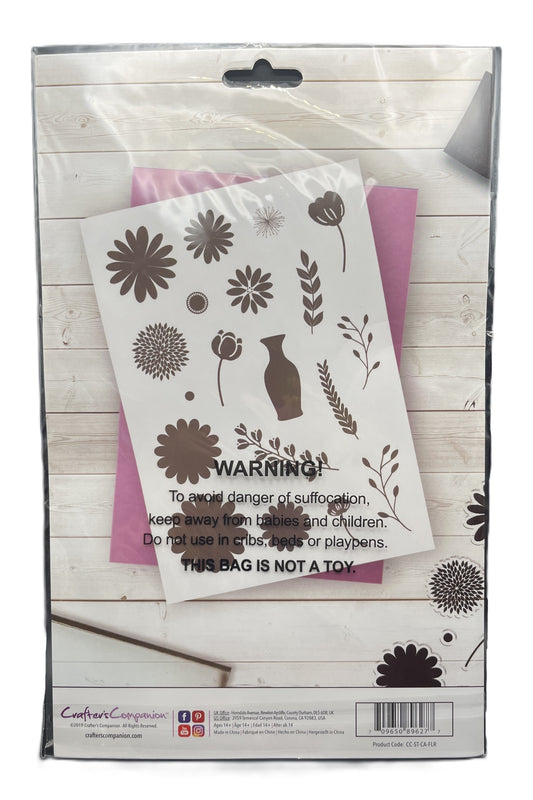 Floral design stencils in a packaging with warning label on a wooden surface
