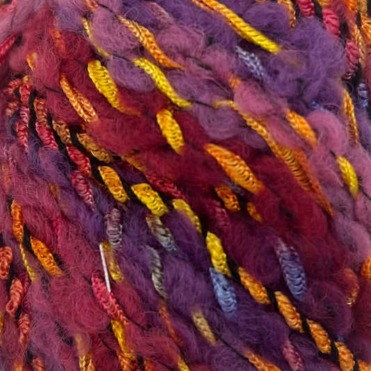 Multicolored skein of yarn on a white background