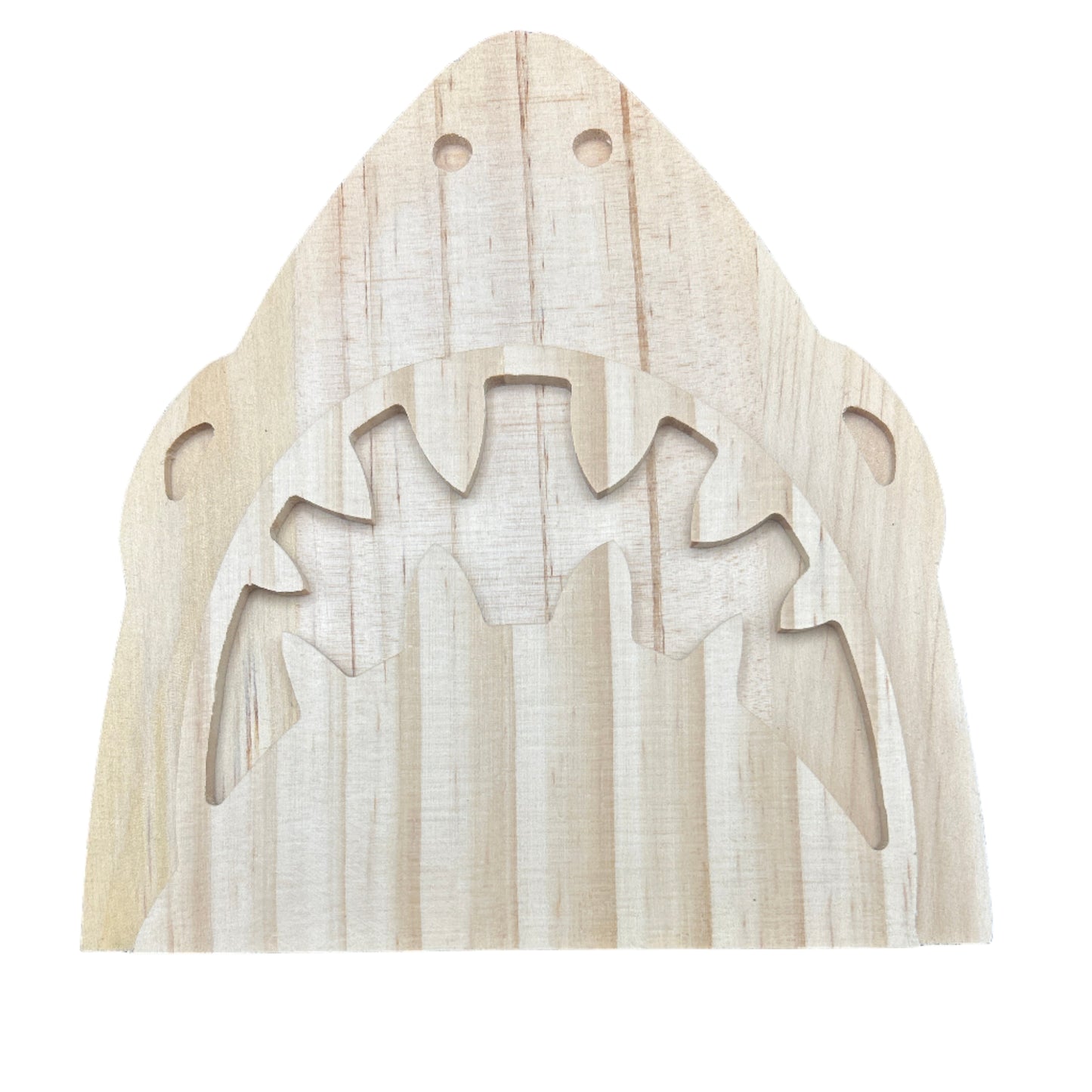 Wooden shark-shaped cutout on a dark blue background