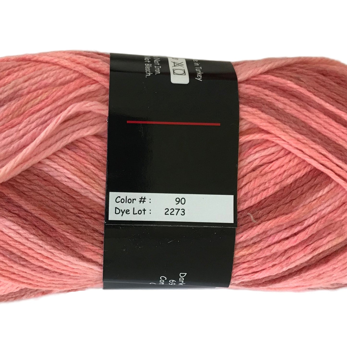 Pink yarn skein with a label on a white background