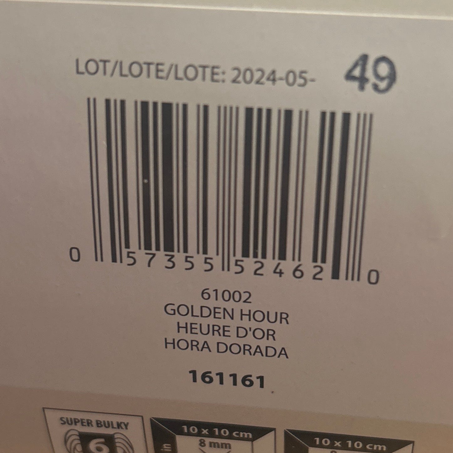 Close-up of a product label with a barcode on a wooden surface
