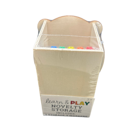Small beige box with a label on a dark surface