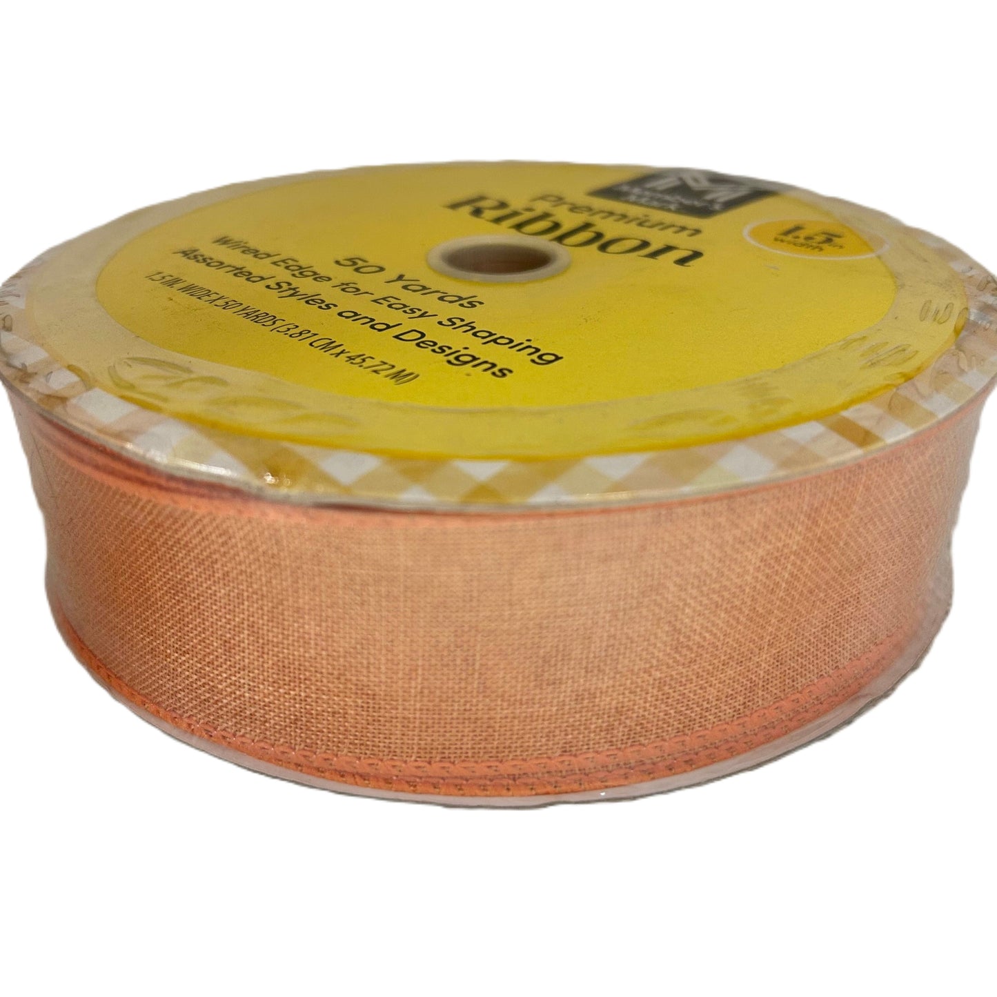 Spool of peach-colored ribbon with a yellow label on a white background