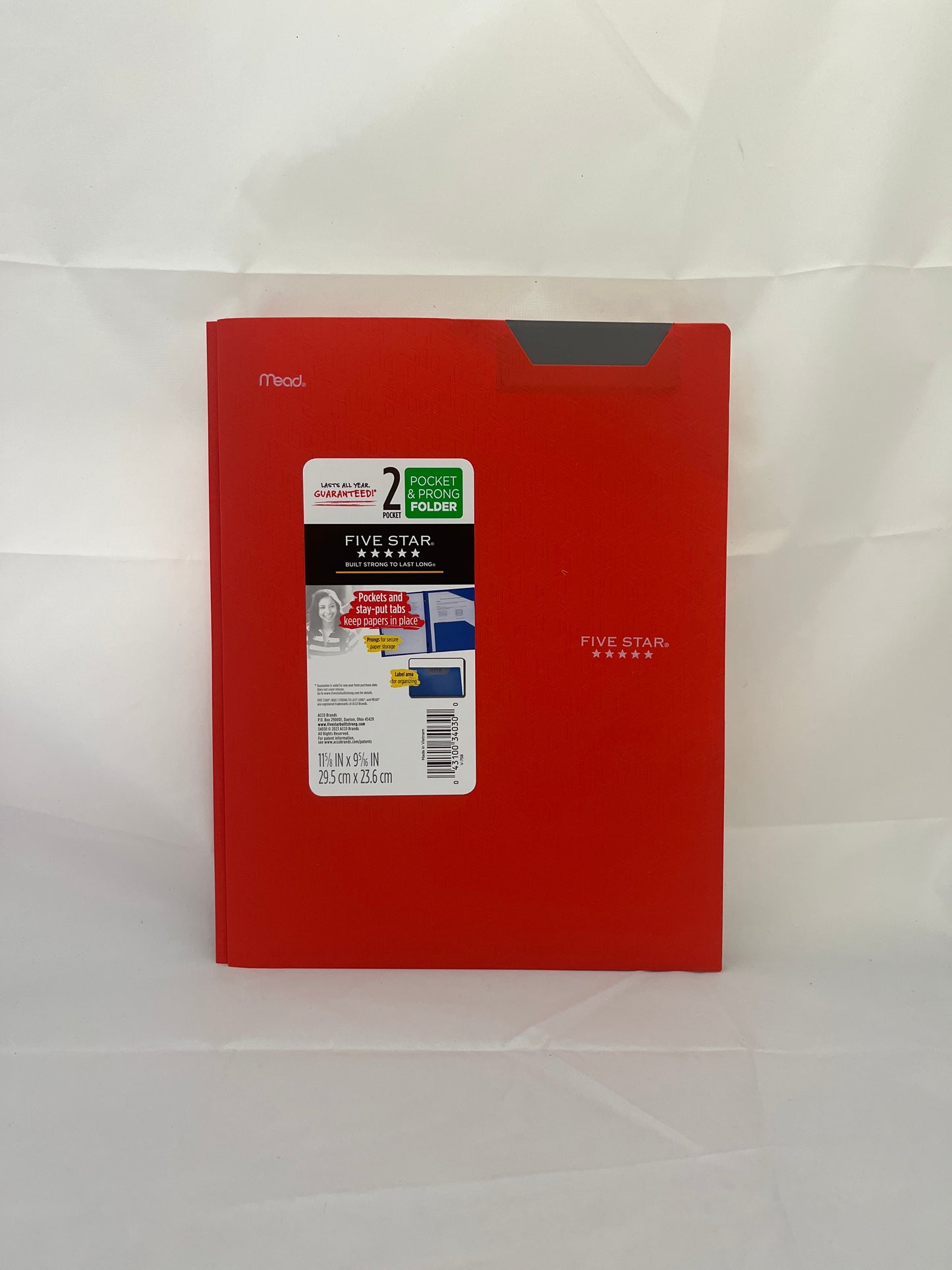 Red notebook with a label on a white background