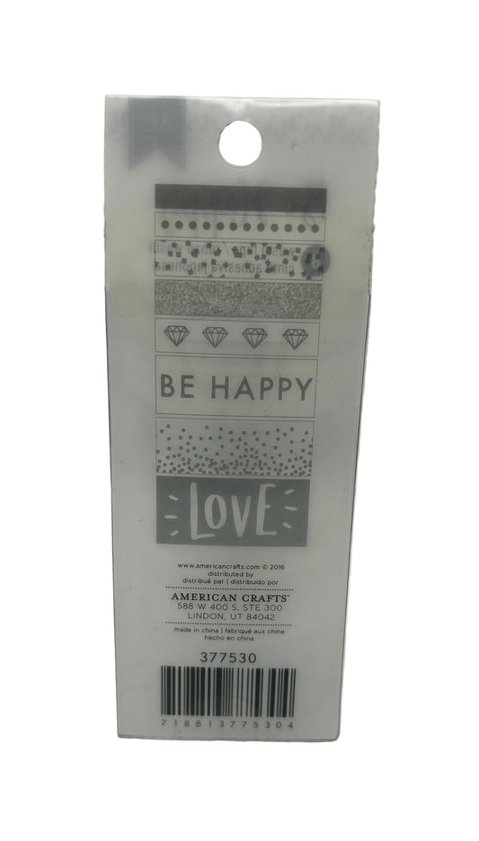 Packaging with 'Be Happy' and 'Love' text on a white background