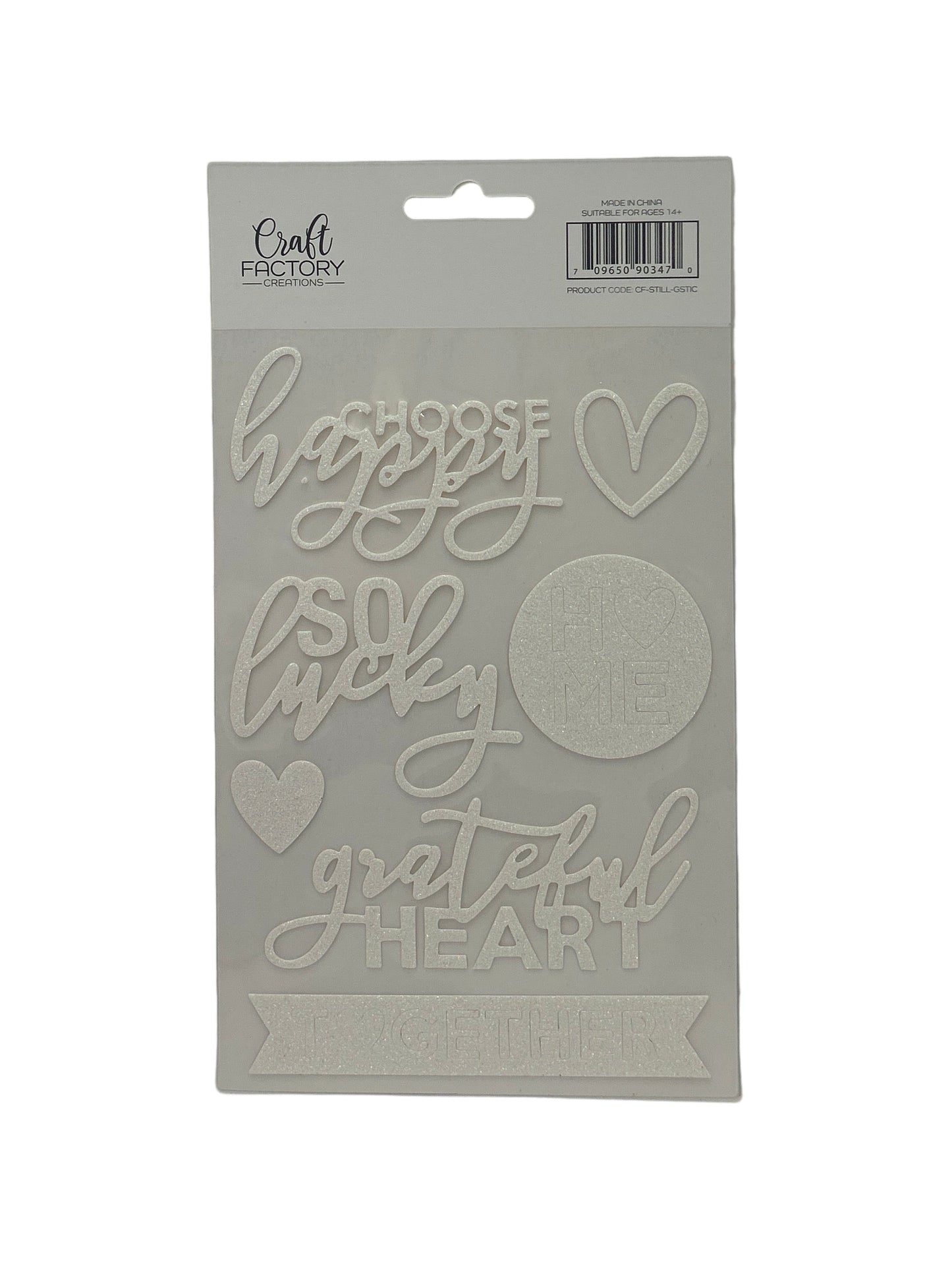 Cardboard cutout with 'happy little grateful heart' text on a white background