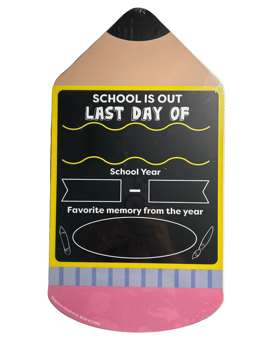 Card with 'School is Out Last Day of School Year' text on a metallic surface