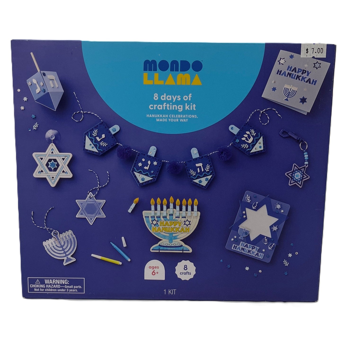 Mondo Llama Hanukkah crafting kit packaging with various craft items on a blue background
