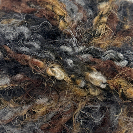 Ball of multicolored yarn on a white background