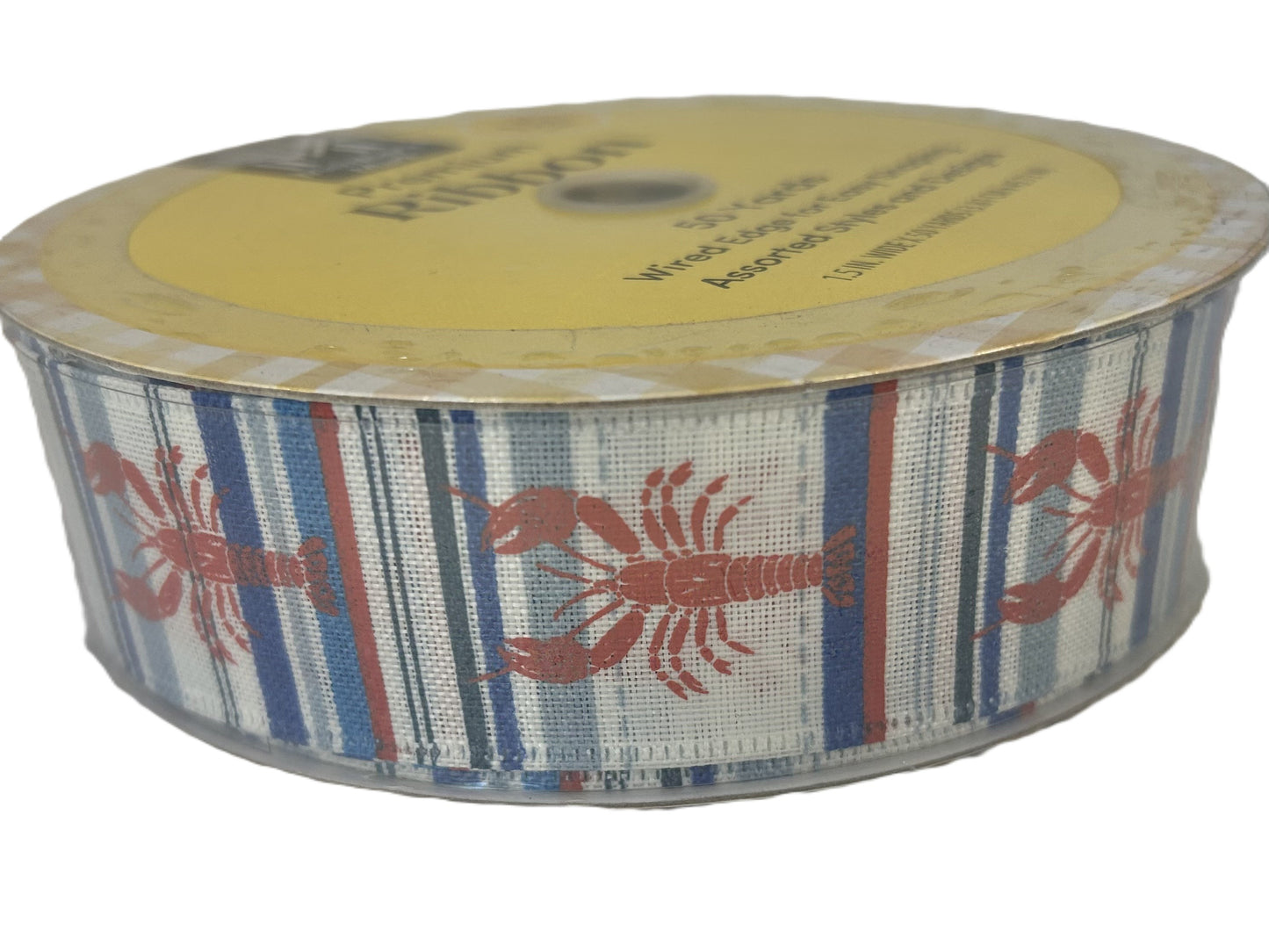 Spool of ribbon with lobster design on a white background