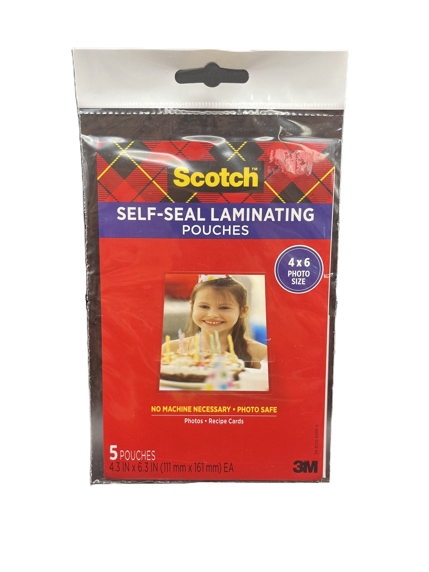 Pack of Scotch self-seal laminating pouches with a child's photo on the packaging.