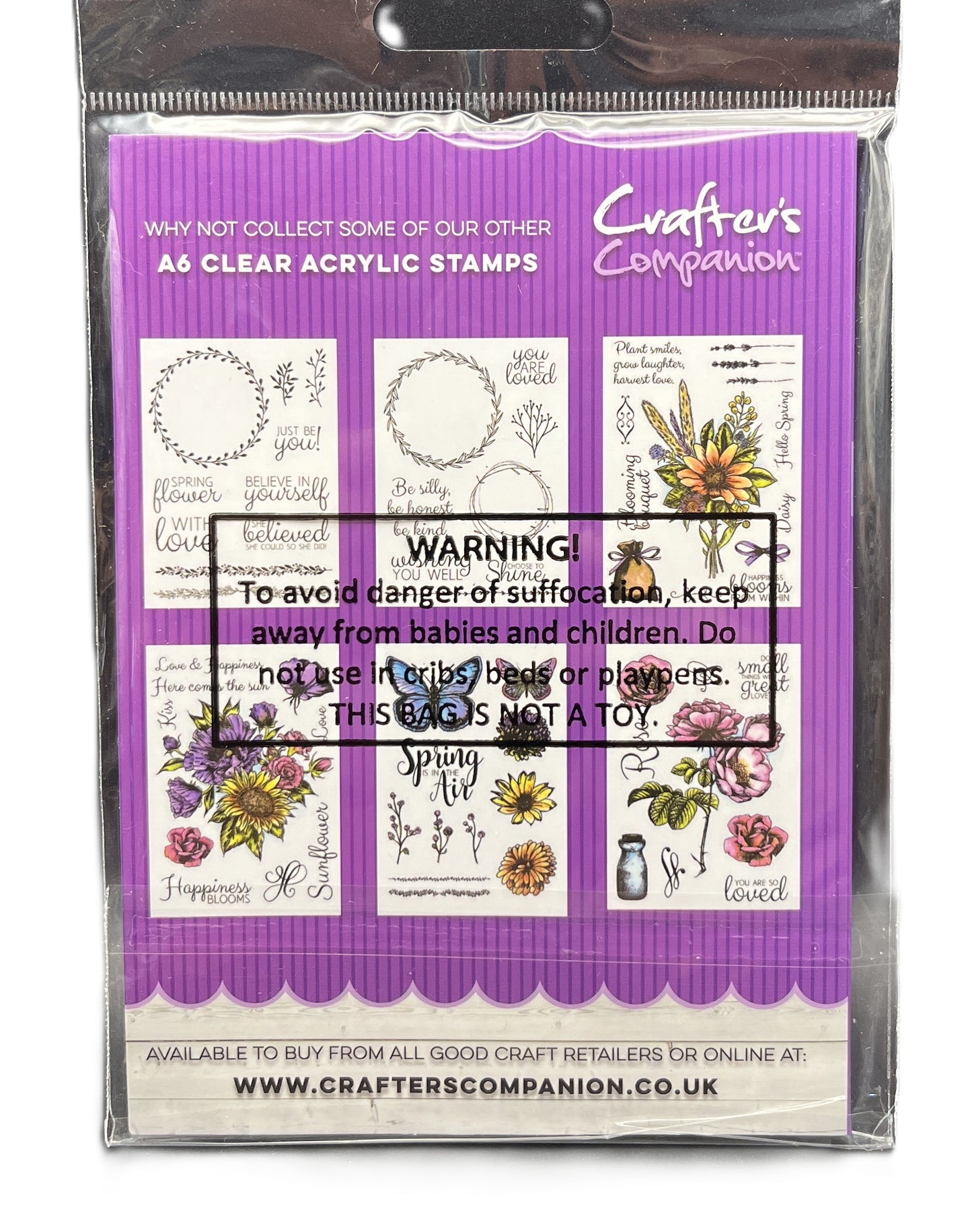 Packaging of Crafter's Companion clear acrylic stamps with a purple border and floral designs.