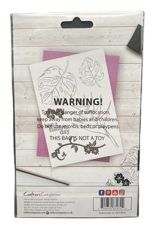 Product packaging with warning label and floral design on a wooden surface