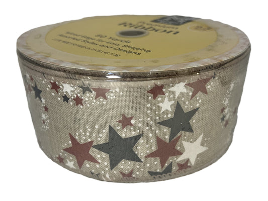 Spool of ribbon with star pattern on a beige background