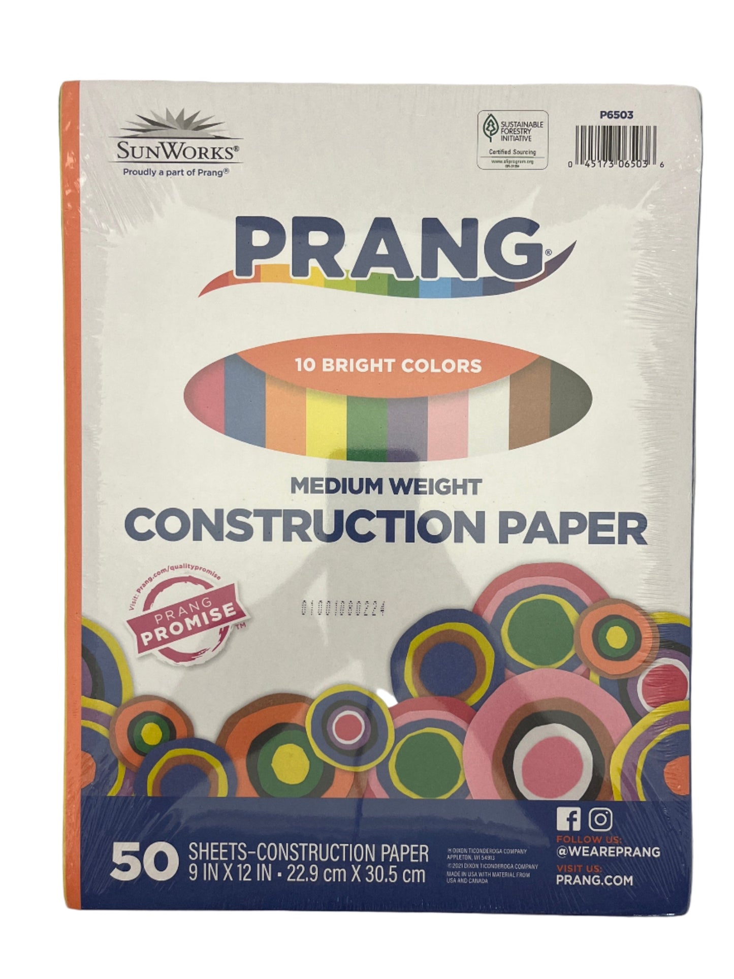 Package of Prang medium weight construction paper on a gray background