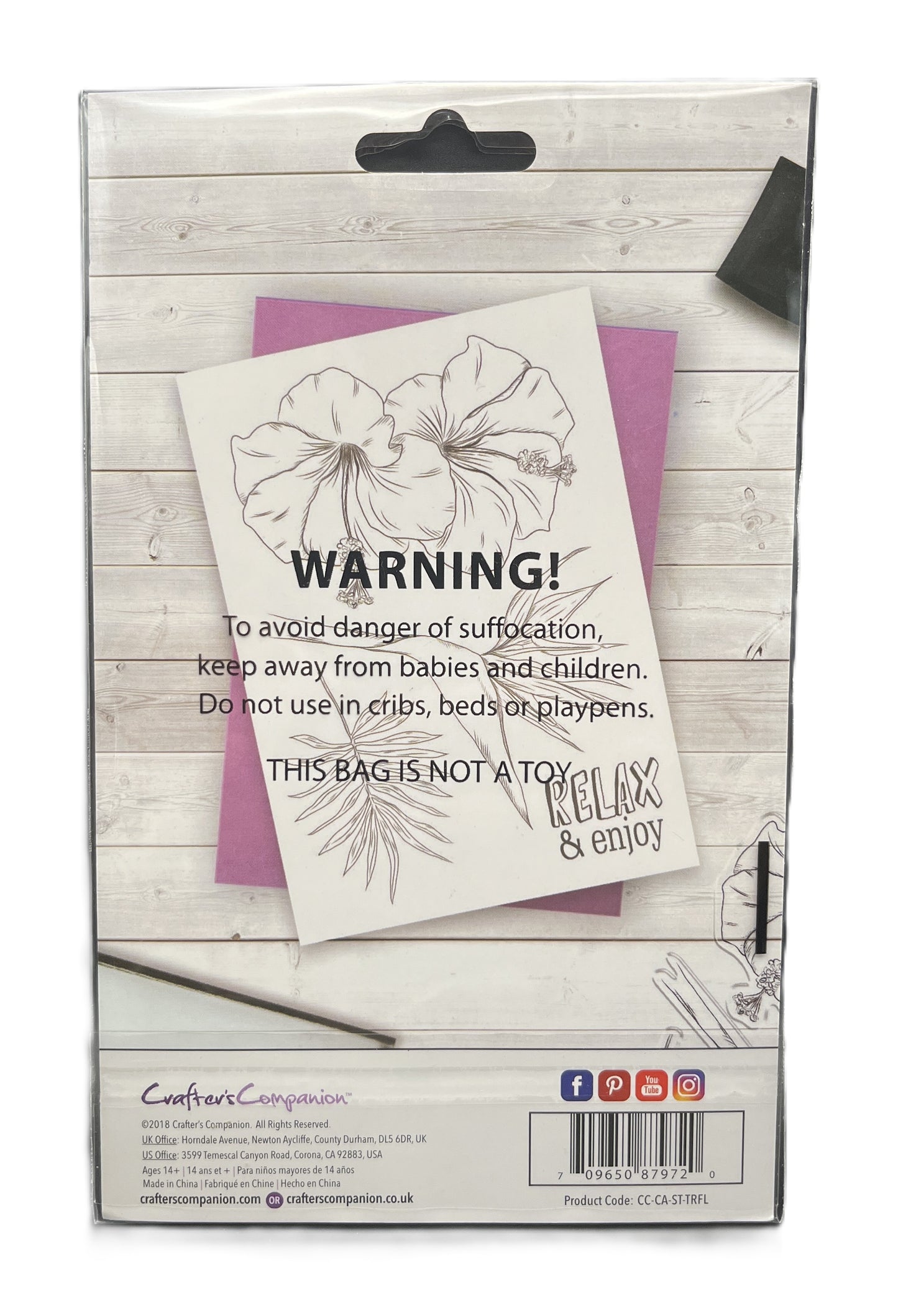 Product packaging with a warning label on a wooden surface
