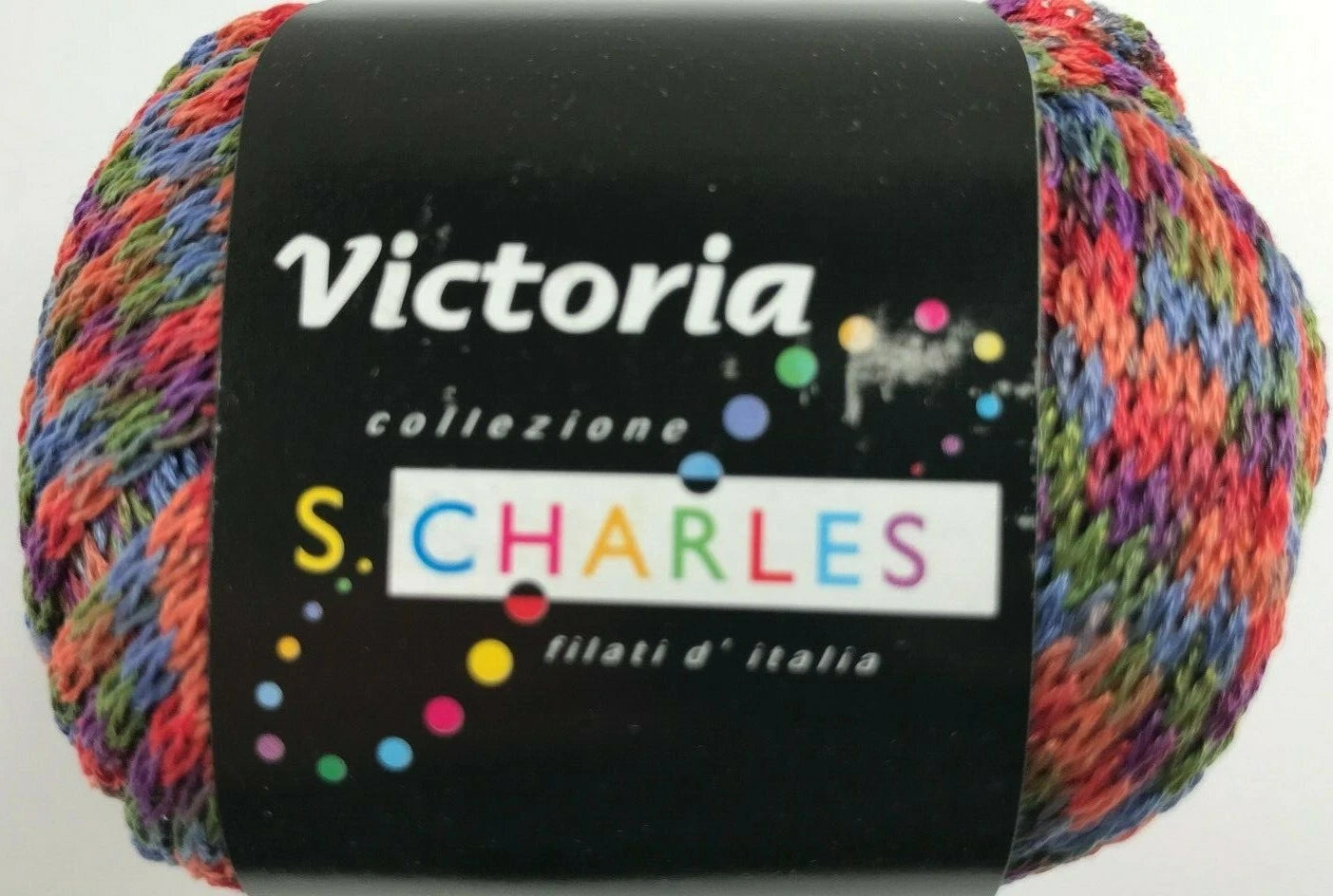 Multicolored yarn ball with 'Victoria' and 'S. Charles' labels on a white background
