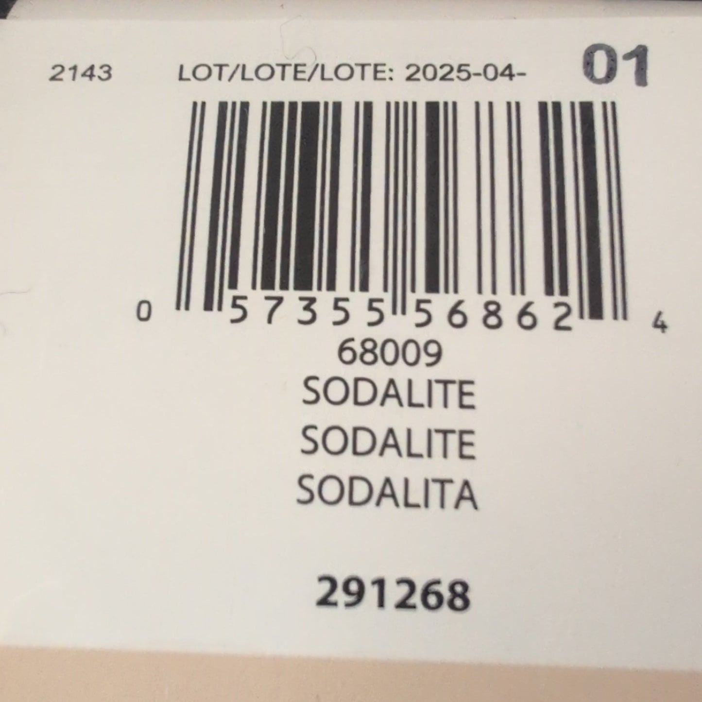 Close-up of a label with a barcode and text on a dark background
