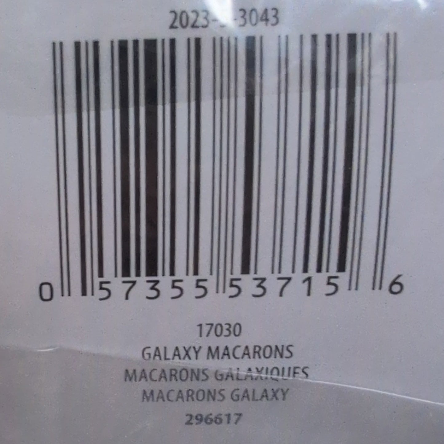 Ball of yarn with a label showing brand information on a wooden surface