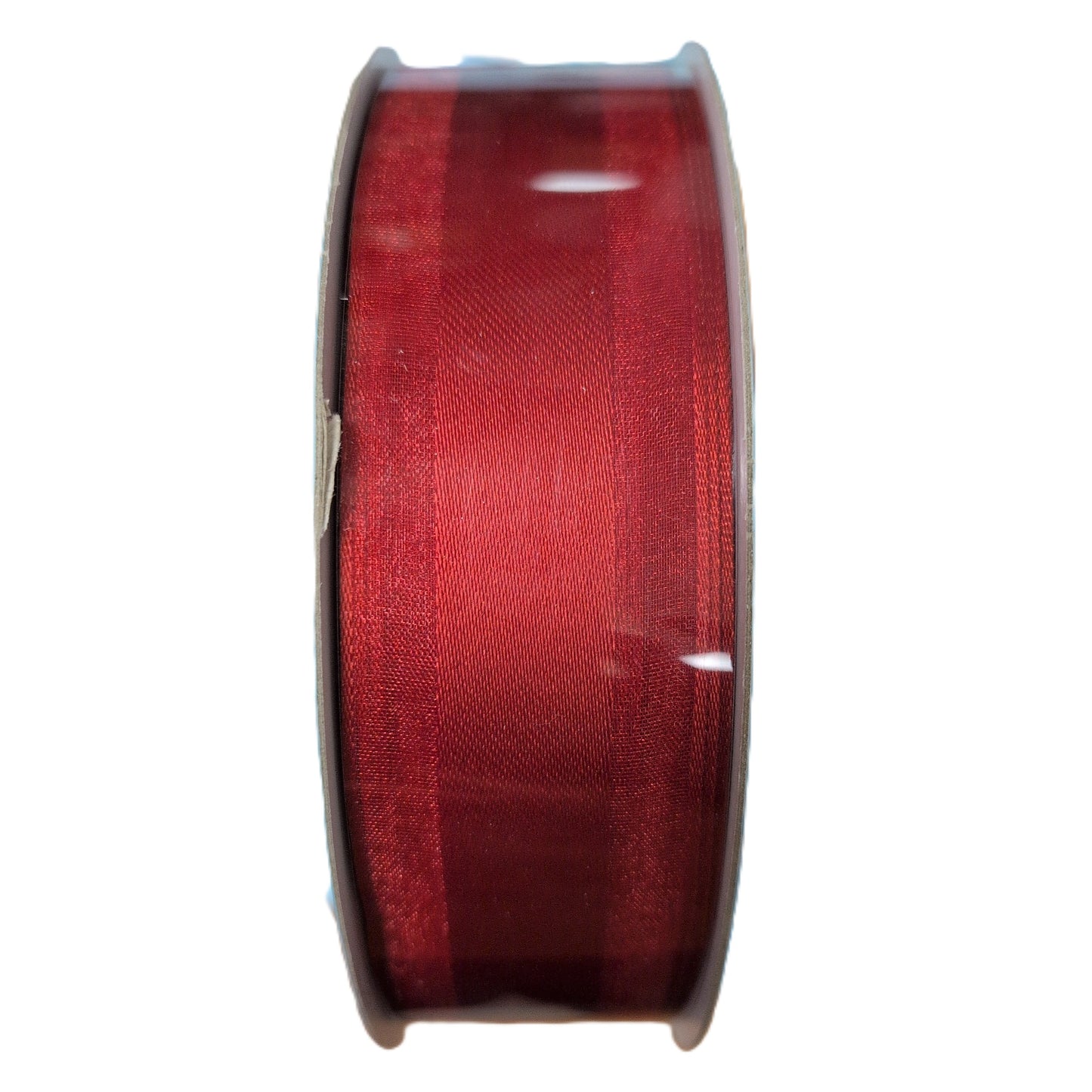 Spool of red ribbon on a white background