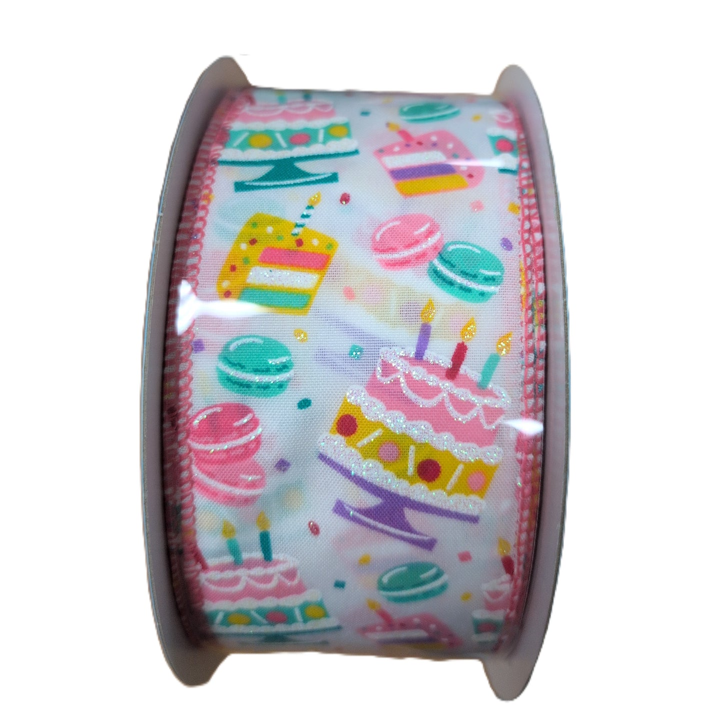 Roll of ribbon with colorful cake and macaron pattern on a white background
