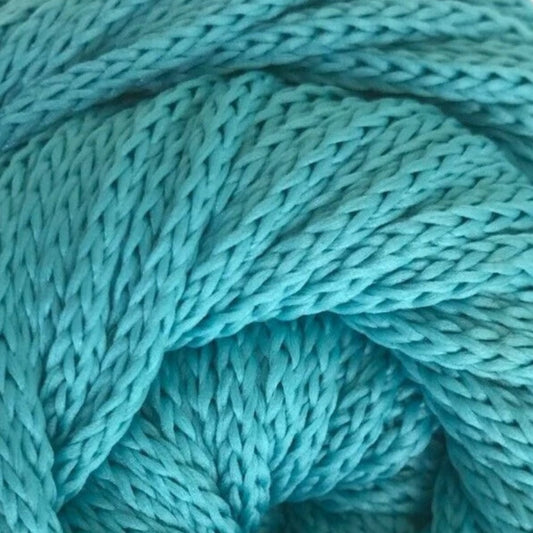 Close-up of teal yarn with a textured pattern
