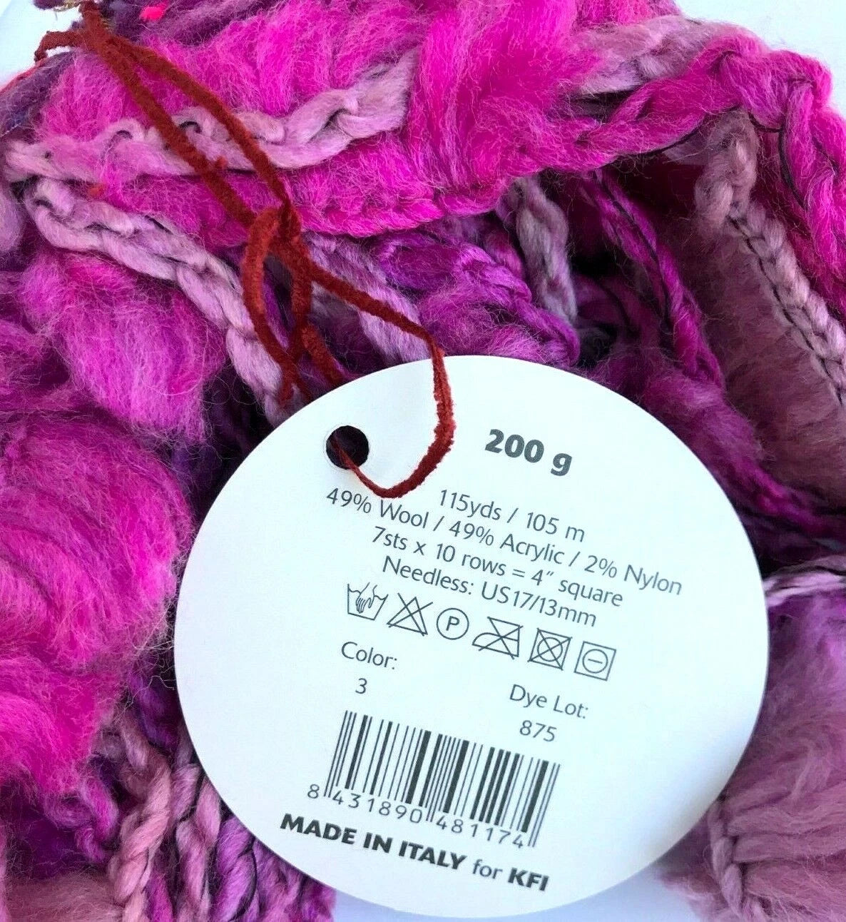 Ball of pink yarn with a label showing details
