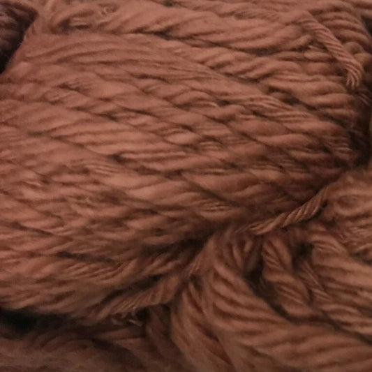 Brown yarn ball with label on a white background