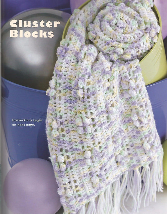Knitted scarf with cluster blocks pattern on a purple background
